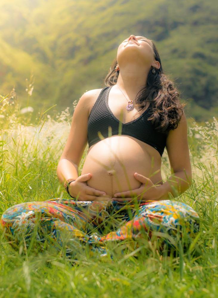 Sunny Pregnant Sitting Grass